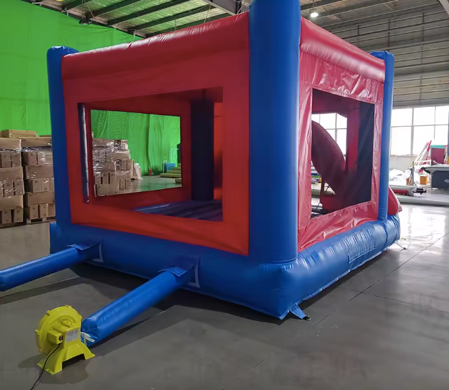 Spiderman bounce house side view with blower